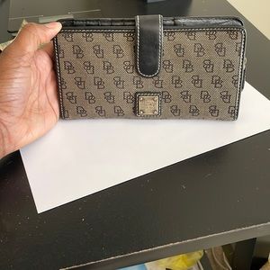 Dooney and Bourke Black and Tan Signature Canvas/Leather Wallet